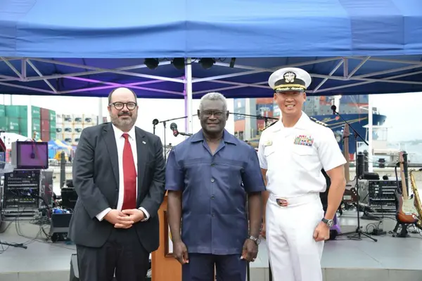 (L-R) Russ Comeau, U.S. Chargé D'Affaires for Solomon Islands, Manasseh Sogavare, Prime Minister of the Solomon Islands, and Capt. Kim, mission commander of Pacific Partnership 2022.