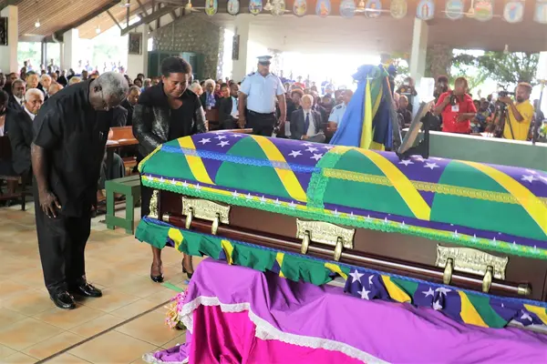 Prime Minister Manasseh Sogavare and Madam Sogavare pay their last respects at the funeral service.