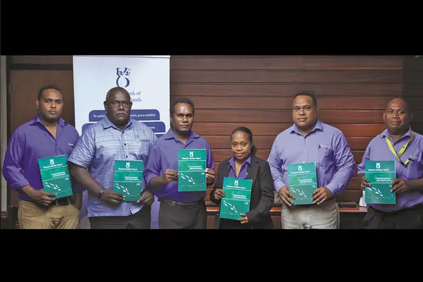 The Financial System Regulation Department (FSRD) Staff with Governor Dr. Luke Forau and Deputy Governor Raynold Moveni with the FS Report released on 02.07.2020.
