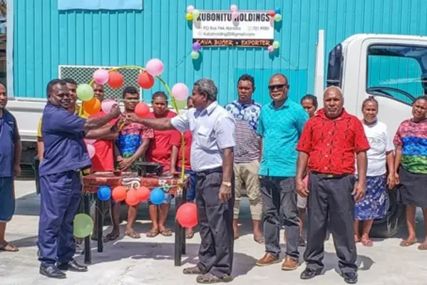 Chairperson of the Economic Stimulus Package Oversight Committee, Mr. McKinnie Dentana hands over the key to the 3 –tonne Isuzu pick-up truck to  Duddley Longamei of Kubonitu Holdings.