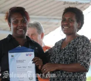 Ruth Bosi(L)receives her certificate from Ms. Afu Billy, Regional Director to the Commonwealth Youth Programme.