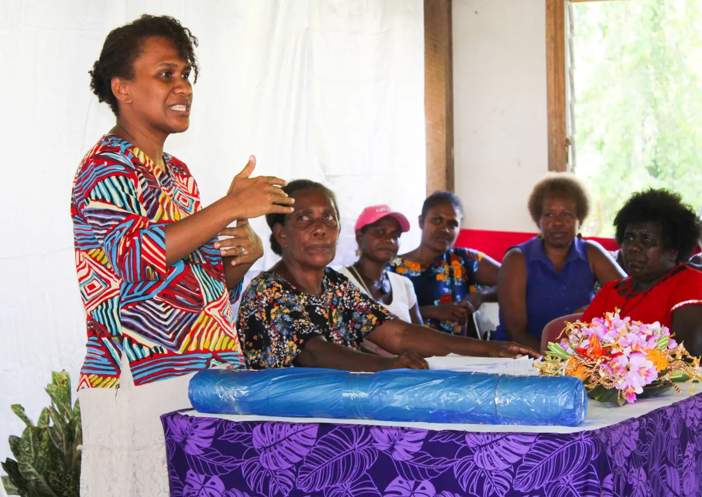 Gender-Community Liaison Officer for TRHDP, Helen Dolaiano speaking to the participants before the training proper starts.