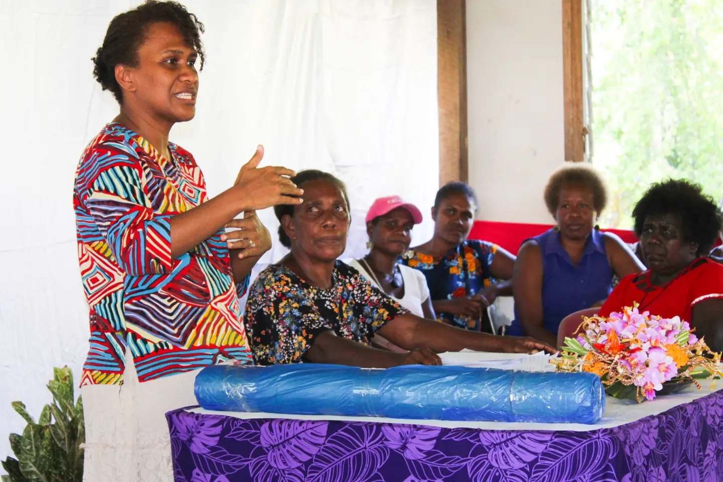 Gender-Community Liaison Officer for TRHDP, Helen Dolaiano speaking to the participants before the training proper starts.