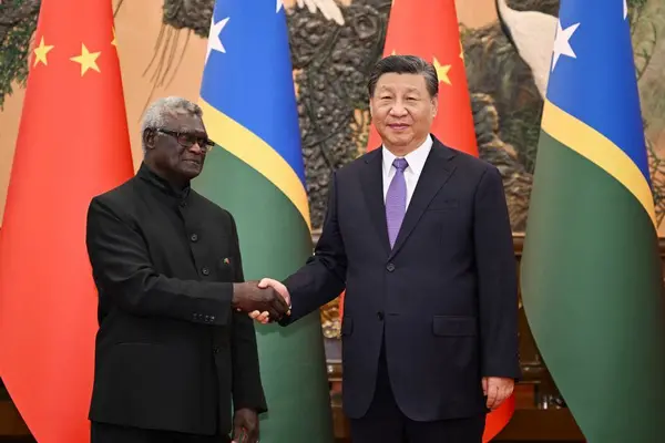 PM Manasseh Sogavare with Chinese President Xi Jinping during a recent visit to Beijing.
