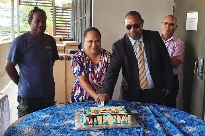 Cutting of the cake by Minister of Fisheries, Hon. Nestor Giro and PROP Coordinator, Samantha Tuti. Looking on SSWA Contractor, Simon Aita'a (left) and PS Fisheries, Dr Christain Ramofafia.
