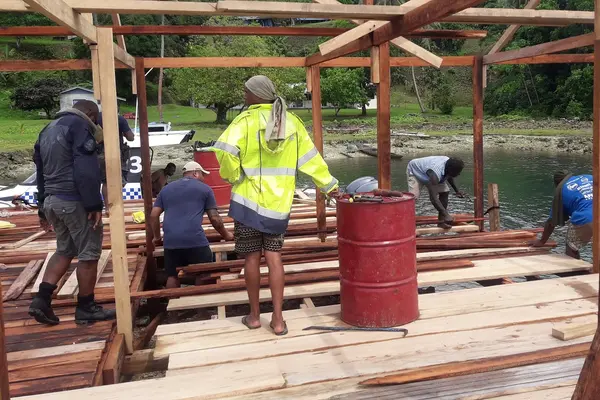 PRT officers and members of the local community construct the Kulitanai jetty.