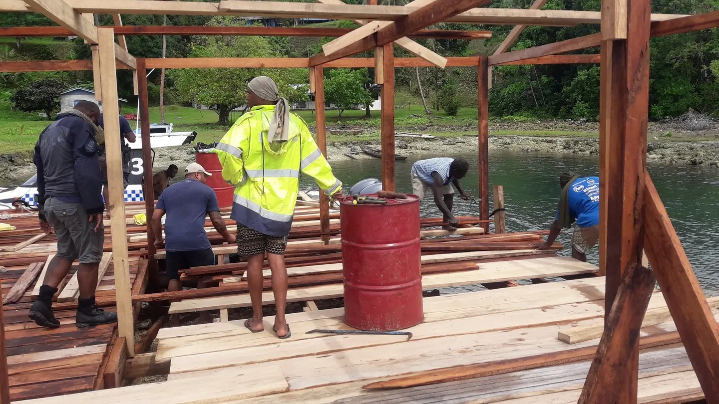 PRT officers and members of the local community construct the Kulitanai jetty.