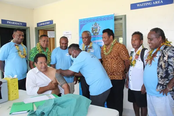 Premier Hon. Willy Tuhagenga taking the first COVID-19 jab for Renbel province.