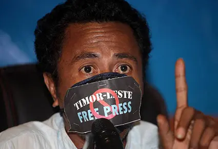 José Belo wears a gag at a Media Law Seminar in Dili hosted by the Secretary for Communication last month. Photo / Jornal Independente, via Pacific Media Centre