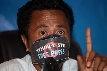 José Belo wears a gag at a Media Law Seminar in Dili hosted by the Secretary for Communication last month. Photo / Jornal Independente, via Pacific Media Centre