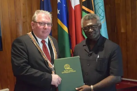 PIDF Secretary-General Francois Martel, (left), with Solomon Islands Prime Minister, Hon. Manasseh Sogavare.