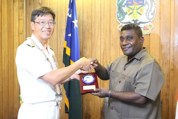 Rear Admiral Yuasa presents a gift to PM Lilo.
