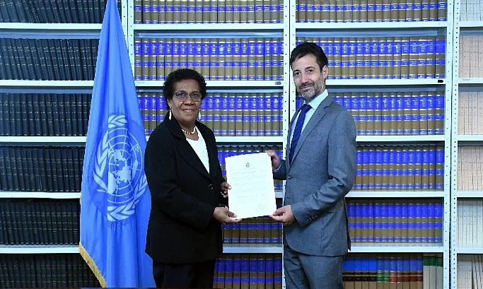 Ambassador and Permanent Representative of Solomon Islands to the United Nations, H.E Mrs. Jane Mugafalu Kabui Waetara and Mr. David Nanopoulos, Chief of the United Nations Treaty Office during the deposit ceremony.