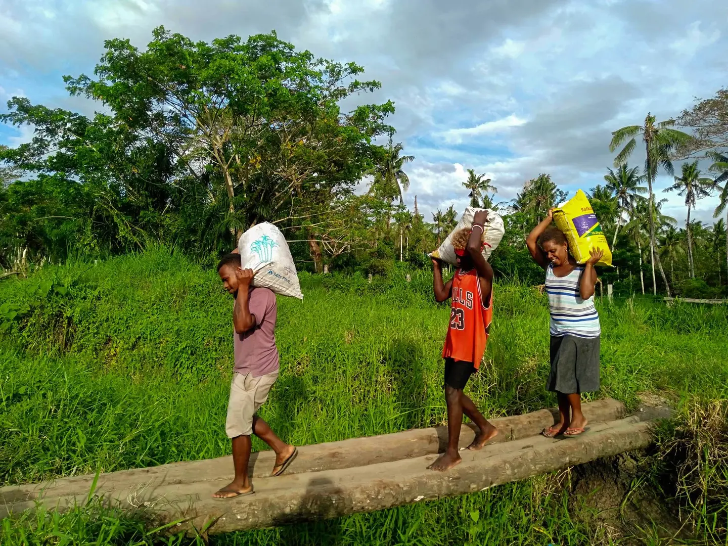 "Women and children have to cross rivers and walk long distances with heavy loads of bags”, Chief Titus Teddy says.