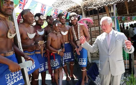 Prince Charles danced with a pan pipe band at the reception at the Governor General's residence.