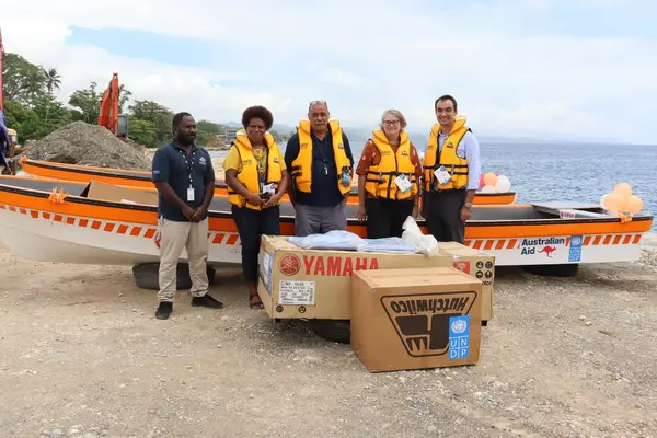 Australian High Commission, UNDP and N-DOC members posed with the boats and equipment.