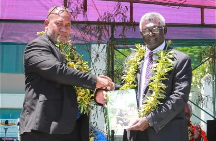 Prime Minister Manasseh Sogavare hands over the copy of the strategy (ASGSIP 2021-2030) to the Minister of Agriculture and Livestock Honourable Senley Levi Filualea.