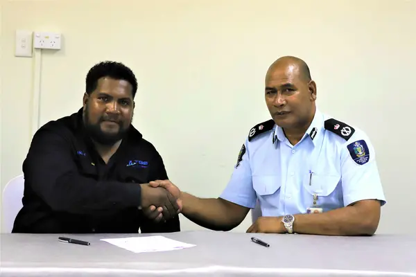 Police Commissioner, Mr. Mostyn Mangau and SICCI Board Chairman, Mr. Ricky Fuo’o at the signing of the MoU.