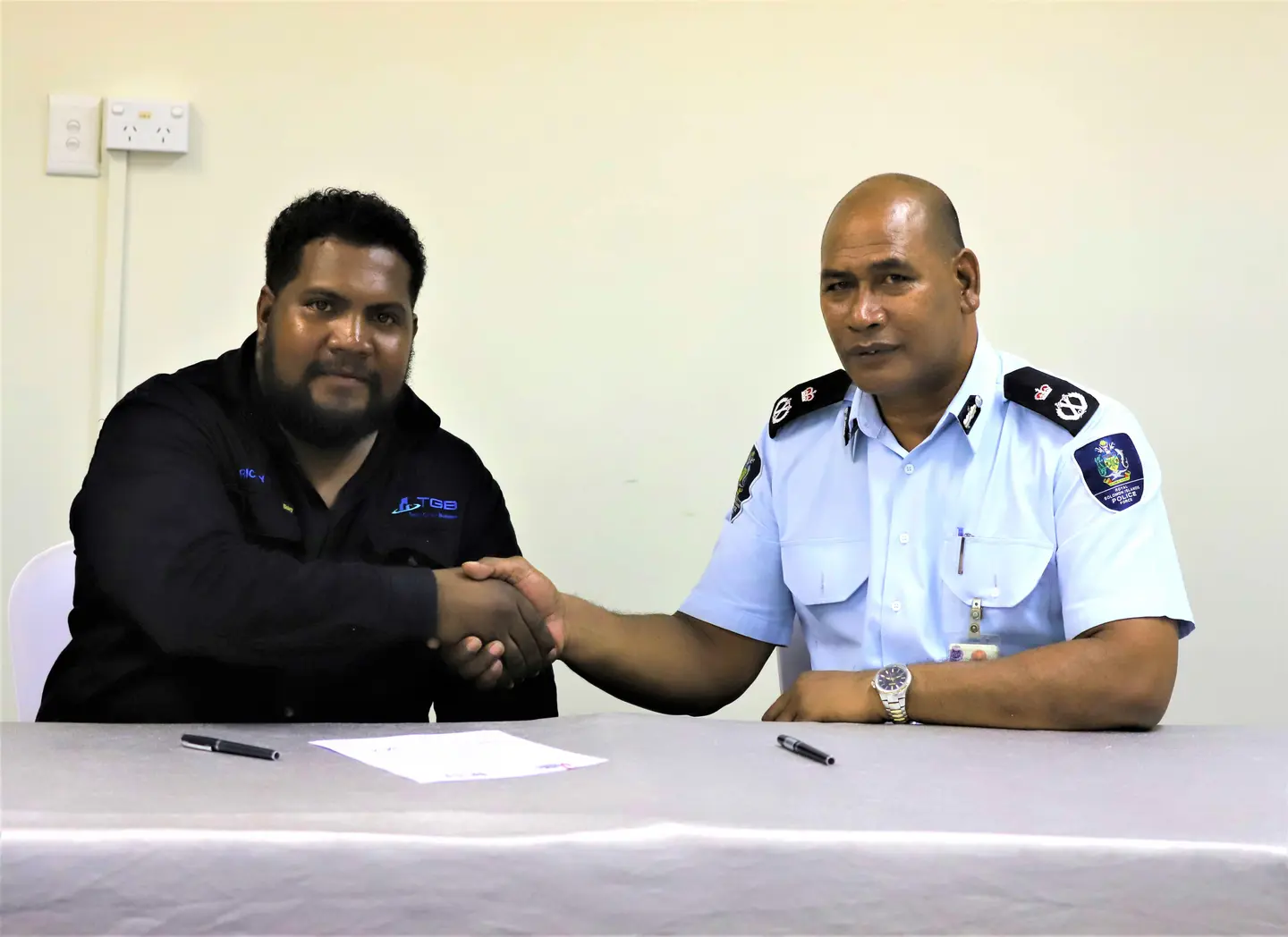 Police Commissioner, Mr. Mostyn Mangau and SICCI Board Chairman, Mr. Ricky Fuo’o at the signing of the MoU.