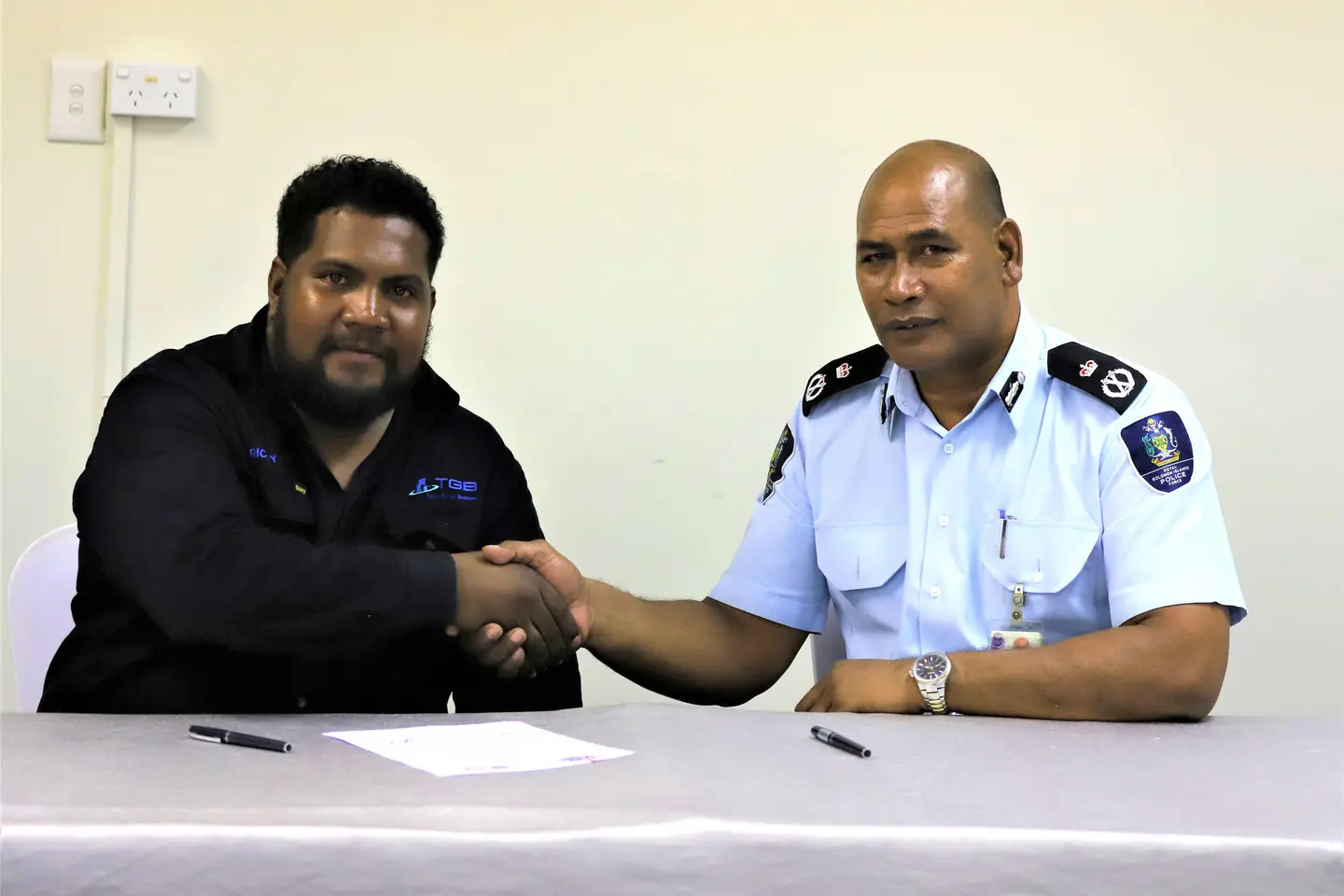 Police Commissioner, Mr. Mostyn Mangau and SICCI Board Chairman, Mr. Ricky Fuo’o at the signing of the MoU.