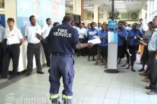 RSIPF Fire Service's Inspector Rodney Kuma entertained and educated bank staff during his fire safety lecture.