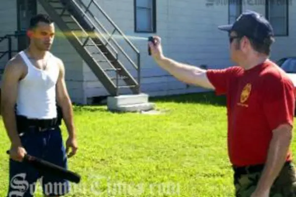 Demonstration of the use of a pepper spray a non-lethal force weapon.
