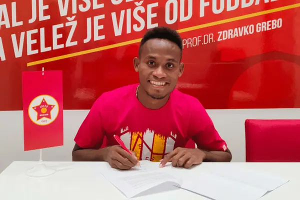 Lea'i puts pen to paper, inking his first professional football contract - and the country's first in Europe.