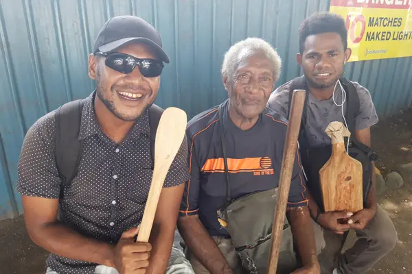 Billy carves wooden spoons, coconut scrapers and other wood work materials to sell for his income.