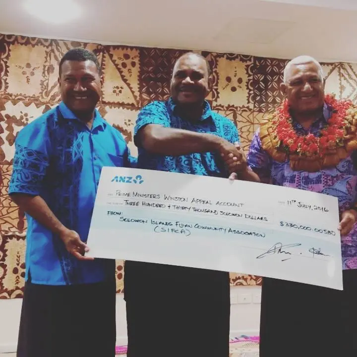 Fiji's Prime Minister, Hon. Voreqe Bainimarama (far right) and members of the Solomon Islands Fijian Community, Mr. Matai Vave (L) and Mr. Tamana Kativerata (C).