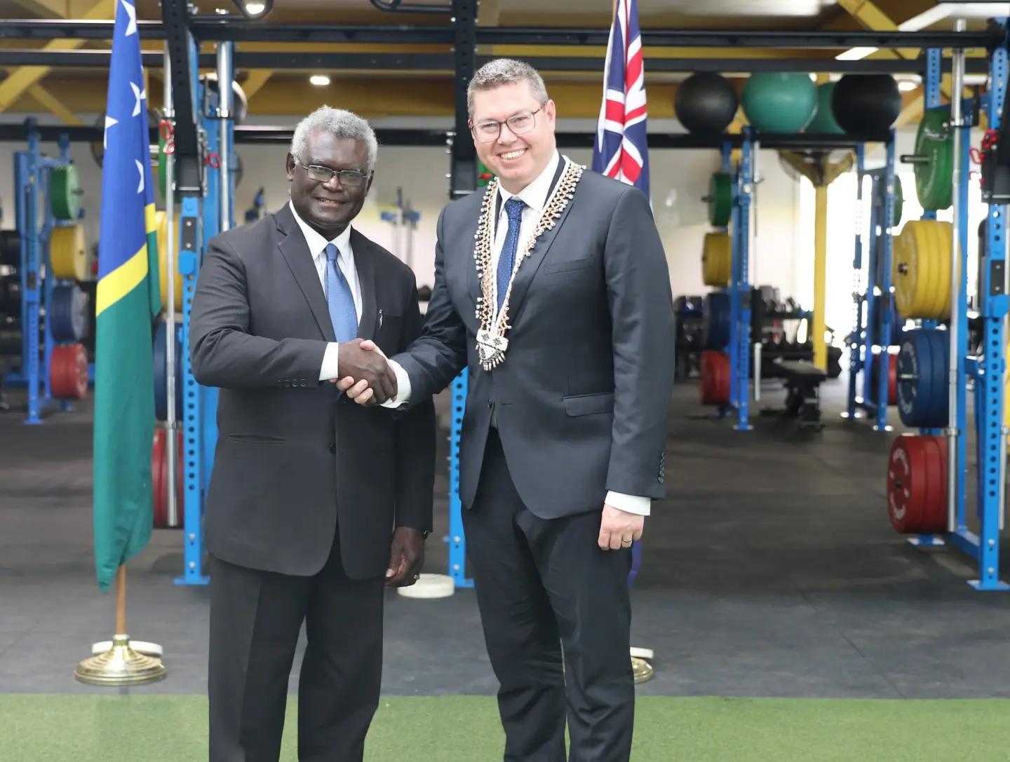 Prime Minister Manasseh Sogavare and Australia's Pacific Minister Pat Conroy at the Sports Institute shortly after making the announcement.