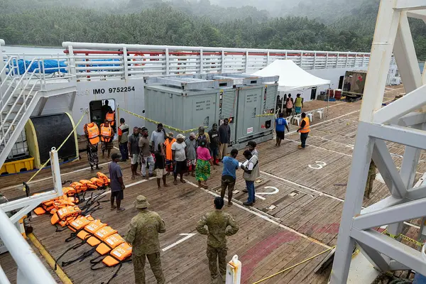 Locals from Savo Island are evacuated to Australian Defence Vessel Reliant.