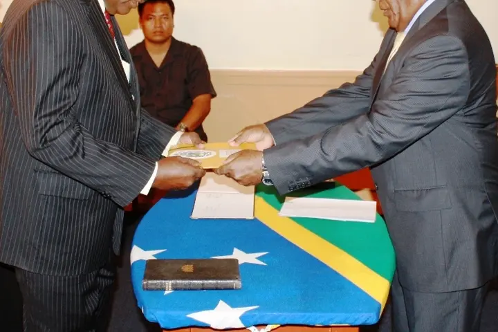 Mr Ngele receives his credentials from Sir Frank on Friday.