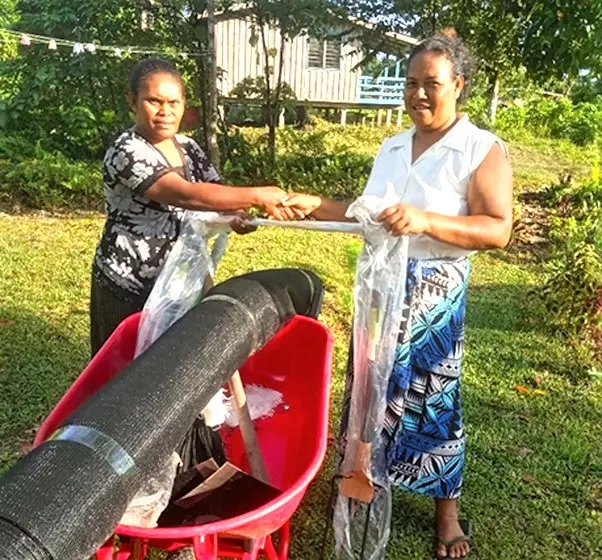 MAL Extension officer in Renbel, Florence Kwai hands over kava project farming tools to the representative of Renkav new kava planting family project.