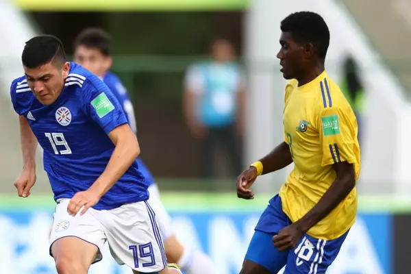 Zani Sale of Solomon Islands U-17 tussle for the ball with Fernando Presentado of Paraguay U-17.