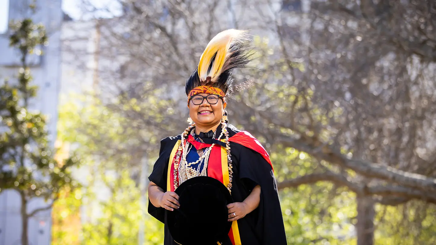 Veronika Kanem in graduation regalia and headdress on 24 September