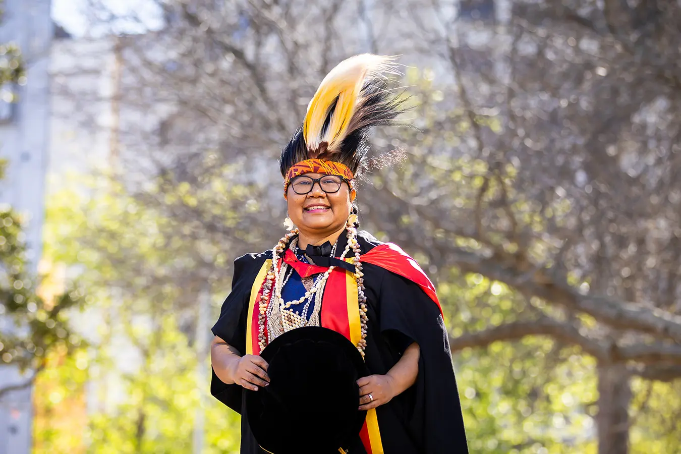 Veronika Kanem in graduation regalia and headdress on 24 September