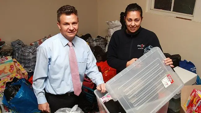 Kingsford-Smith federal Labor MP Matt Thistlethwaite with Jean Ford with all of the clothes and items collected to be sent to the Solomon Islands.