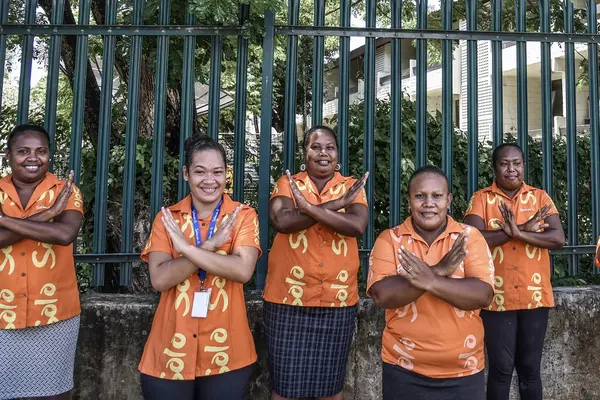 The women of Tourism Solomons making the ‘balancing for better’ sign as they celebrate International Women's Day 2022.