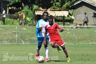 Leslie Leo (L) challenges a Rendova Devon player.