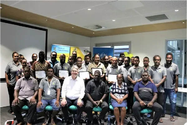 Permanent Secretary McKinnie Dentana with Australian High Commission Counsellor Kevin Playford pictured with staff of the ICT Center, at the launch of several new ICT projects.