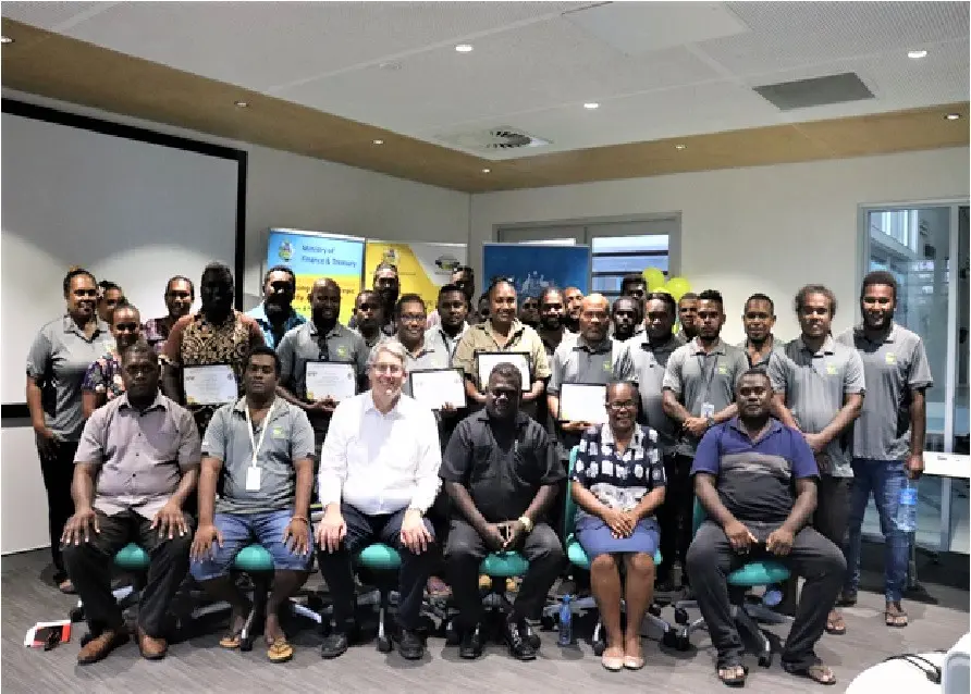 Permanent Secretary McKinnie Dentana with Australian High Commission Counsellor Kevin Playford pictured with staff of the ICT Center, at the launch of several new ICT projects.
