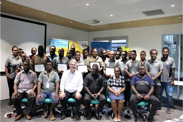 Permanent Secretary McKinnie Dentana with Australian High Commission Counsellor Kevin Playford pictured with staff of the ICT Center, at the launch of several new ICT projects.