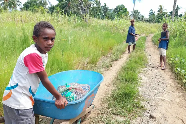“With the full installation of the water supply system here, I will no longer travel far to collect clean water for drinking and cooking using my wheelbarrow,” says Alphonse Bua.