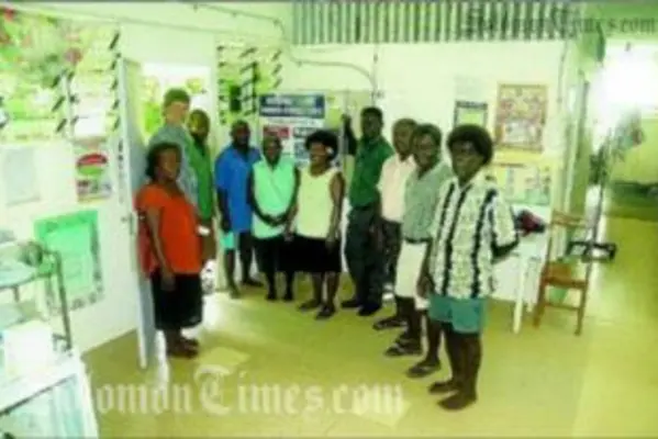 Peter Clement and Kukudu clinic officials and the new power unit. 