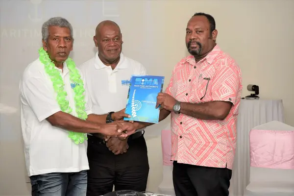 (L-R) Chairman of the SIMA board, Robert Bokelema, a staff from SIMA and MID Deputy Secretary, Jimmy Nuake with the newly launched corporate plan document