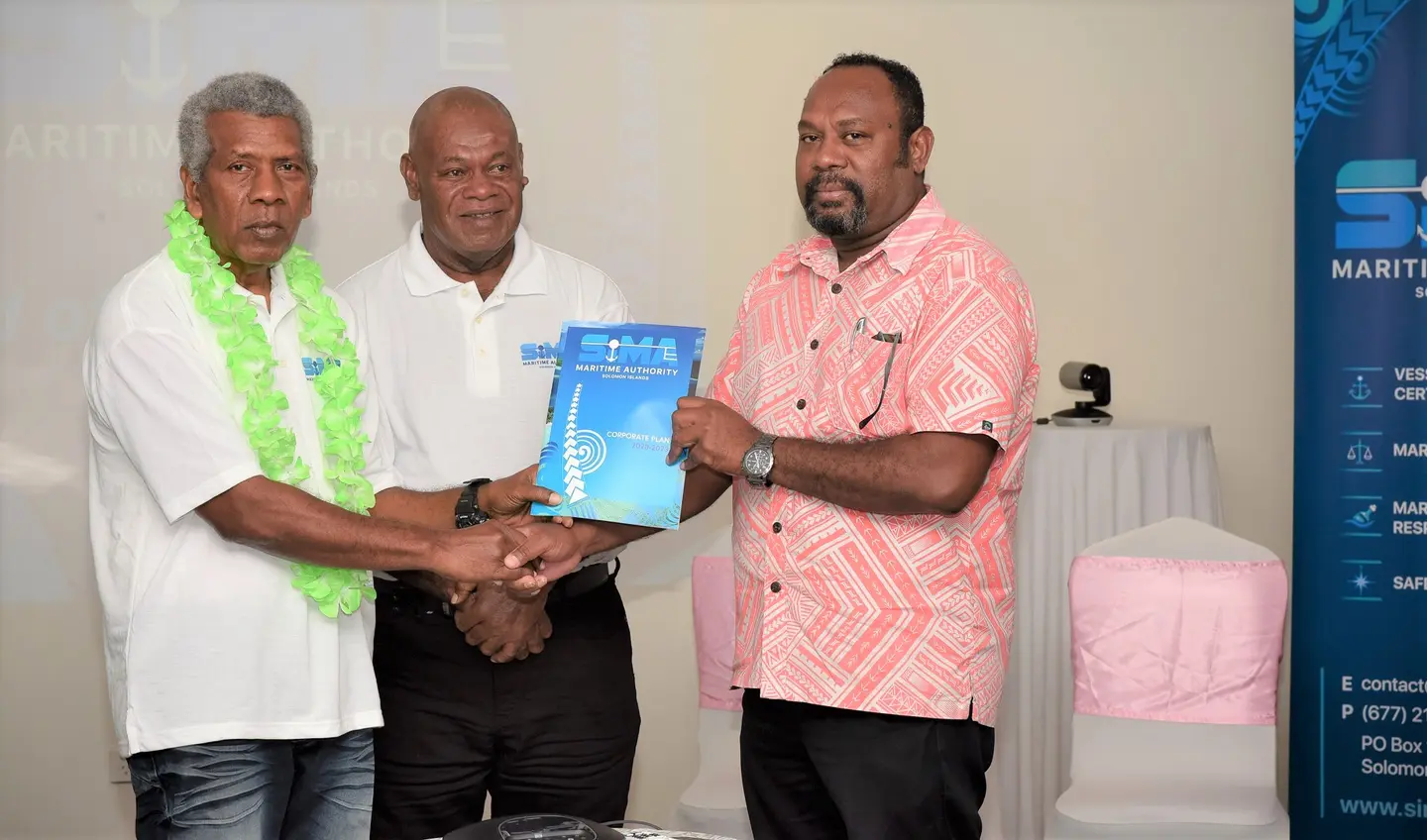 (L-R) Chairman of the SIMA board, Robert Bokelema, a staff from SIMA and MID Deputy Secretary, Jimmy Nuake with the newly launched corporate plan document