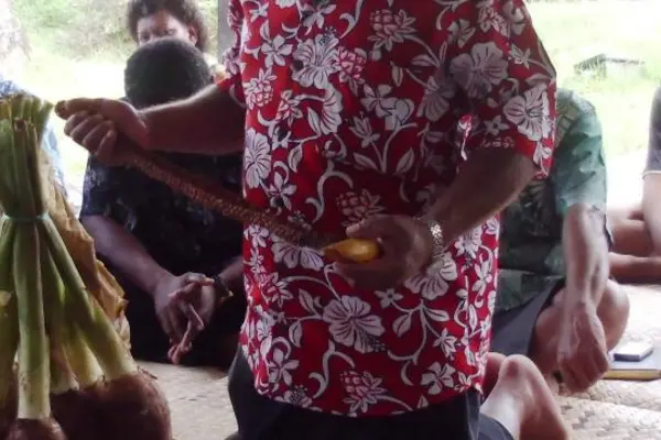 A representative and spokesperson for Solomon Islands students presenting traditional gifts to the Fijian family during the ceremony on Sunday 14th April.