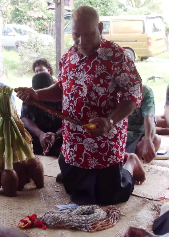 A representative and spokesperson for Solomon Islands students presenting traditional gifts to the Fijian family during the ceremony on Sunday 14th April.
