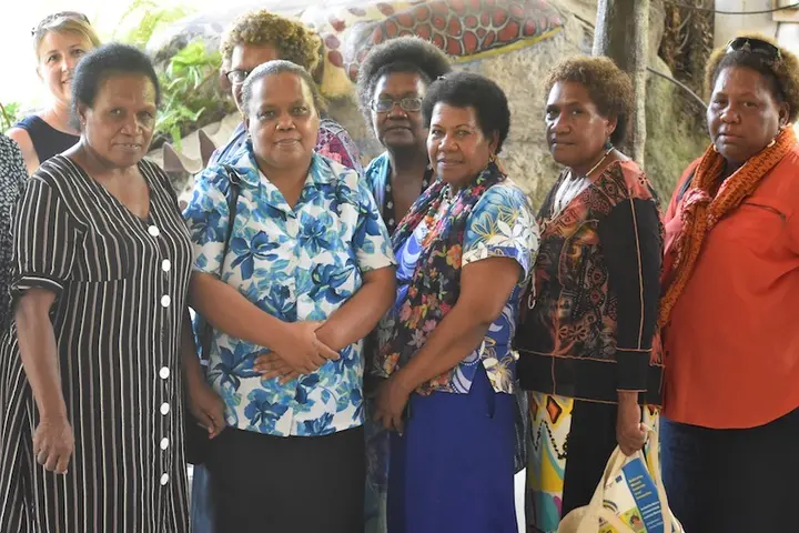 Two women candidates Pauline Radoe, second from left, and Rose Anilabata, right, with their campaign managers and workshop facilitators at the Honiara Hotel on Tuesday.