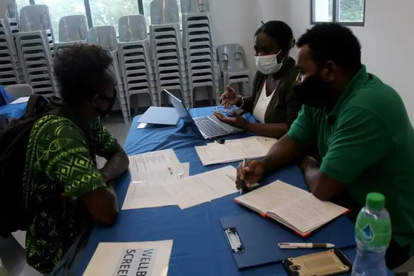 SINIS High-Performance WLP officer Misook Rany and WLP intern Robert Vunagi assessing an athlete during the induction on well being screening process.